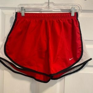 Red Nike women’s Dri-fit shorts.